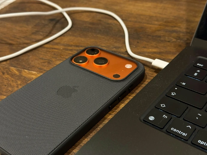 Smartphone connected to a laptop with a cable